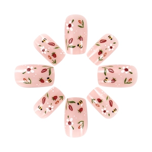 Short glossy pink press-on nails set with strawberry and tulip floral patterns