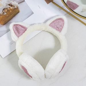 Detail of plush white faux fur earmuffs with cute cat ear design and pink sequins