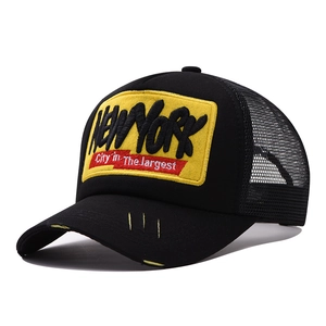 Distressed black and yellow New York mesh trucker hat with vintage embroidery and mesh back