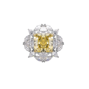 Macro shot of S925 silver ring featuring a yellow cushion-cut stone and marquise accents