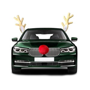 Close-up of plush camel reindeer antlers and red nose set for festive car decoration