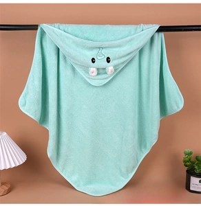 Detail of baby hooded towel showing mint green coral fleece and cute walrus embroidery