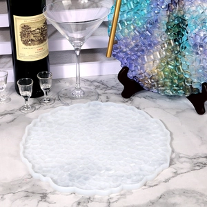 Detailed silicone mold for DIY resin tray featuring wavy edges and faceted texture