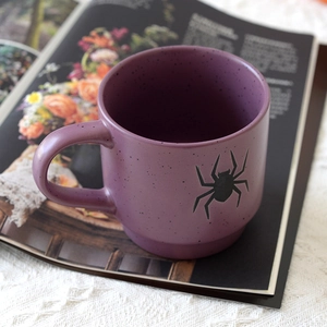 Halloween purple ceramic mug with black spider pattern on stylish lace background
