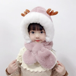 Detail of plush baby winter hat with brown antlers and soft pink faux fur lining