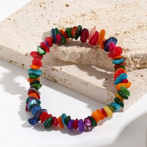 Detail showing natural colorful irregular gemstone beads on a bohemian stretch bracelet