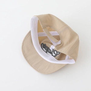 Detail view of khaki baby cap with velcro strap and soft embroidered inner lining