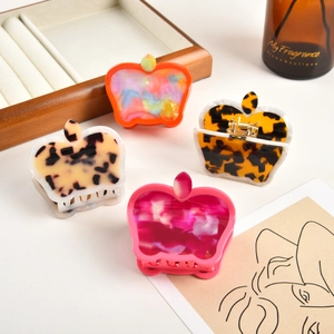 Sweet acetate apple-shaped hair claws in four vibrant colors and tortoiseshell patterns