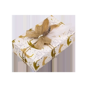 Detail of leopard print wrapping paper with feather, pearl and burlap bow decoration