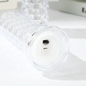 Detail view of crystal rose lamp base showing the USB charging port and manual toggle switch