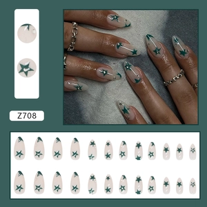 Almond-shaped press-on nails with dark green star art and rhinestones in 24-piece set
