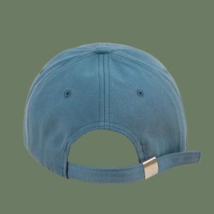 Detail view of the metal adjustable buckle and breathable vents on the blue cotton baseball cap