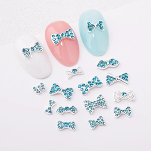 Blue bow nail charms with silver alloy base and rhinestones for manicure art decoration