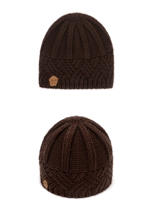 Detailed close-up of dark brown chunky knit beanie showing rhombic patterns and texture