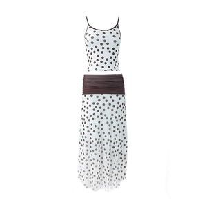 Close-up of contrast brown pleated waistband on polka dot summer skirt two-piece set