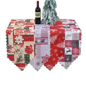Christmas table runner with deer and floral prints featuring festive scalloped edges