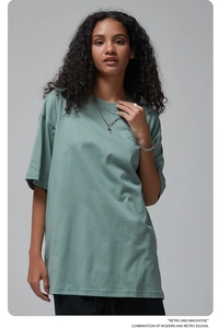 Detail of grey-green oversize cotton T-shirt featuring dropped shoulders and crew neck