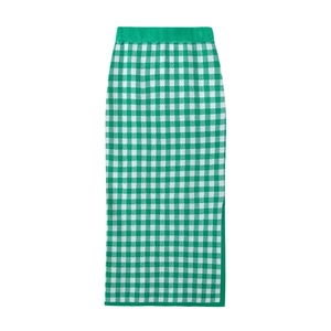 Detail of green and white gingham knitted pencil skirt featuring a side slit design