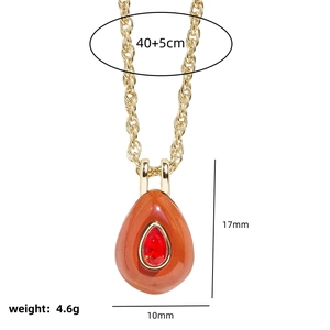 Gold necklace with red zircon teardrop pendant showing 17mm size and 40+5cm chain