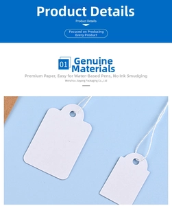 Macro shot of white kraft jewelry price tags with smooth writing texture and strings