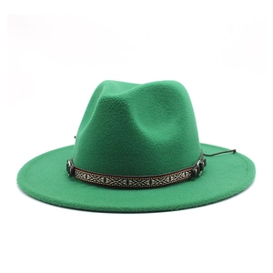 Detail of green fedora hat featuring ethnic woven band and metal buckle accessory