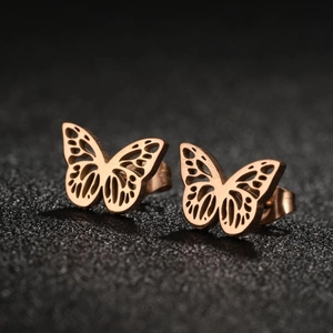 Rose gold stainless steel butterfly earrings with hollow wing design on black texture