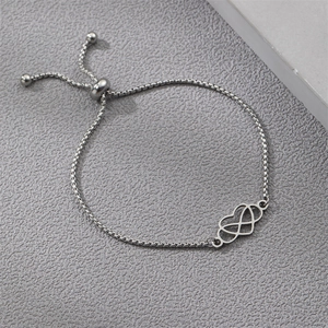Detailed view of silver adjustable box chain with heart and infinity symbol pendant
