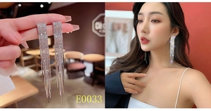 Detailed macro view of long sparkling silver tassel earrings with crystal rhinestones