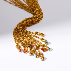 Macro shot of titanium steel necklaces featuring various colorful birthstone pendants