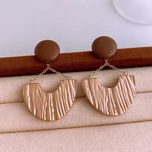 Vintage U-shape pleated earrings with deep brown matte studs and antique gold metal finish