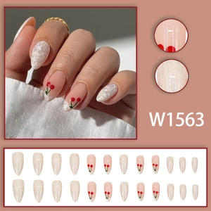 Almond shaped press-on nails with red cherry patterns and white marble texture