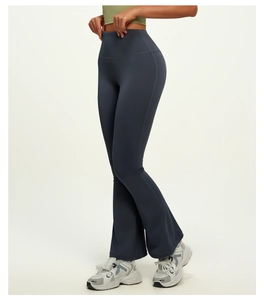 Detail view of high waisted dark blue flare leggings for yoga with breathable stretch fabric