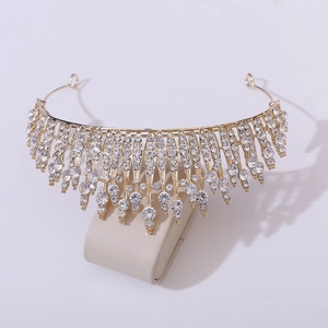 Detailed close-up of golden bridal crown with sparkling rhinestones and fringe drops