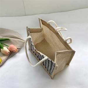 Large houndstooth jute tote bag with cotton rope handles and woven pattern details