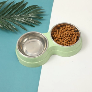 Detail of pet double bowl with stainless steel inserts and green matte eco-friendly base
