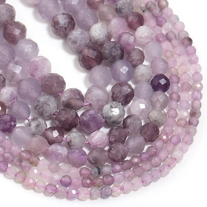 Macro shot of purple faceted gemstone beads showing detailed cut and natural texture