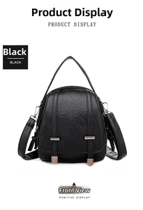 Front view of black pebble leather crossbody bag with dual vertical decorative straps