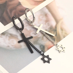 Detail view of black and silver stainless steel earrings with cross and hexagram charms