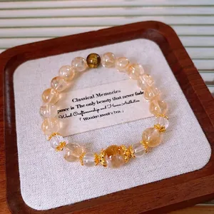 Elegant yellow citrine and tiger eye stone beaded bracelet with golden floral accents