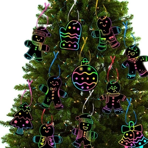 DIY Christmas scratch art ornaments with gingerbread man and tree hanging on a tree