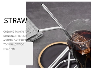 Reusable stainless steel straw in a glass of iced cola with typography background