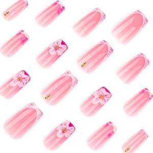 Pink zebra pattern press-on nails with 3D floral accents and French manicure tips