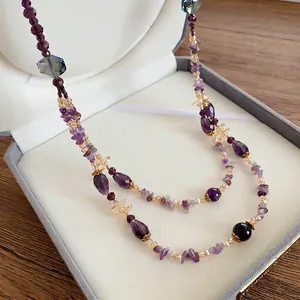 Bohemian multilayer beaded necklace with purple amethyst, amber glass, and gold accents