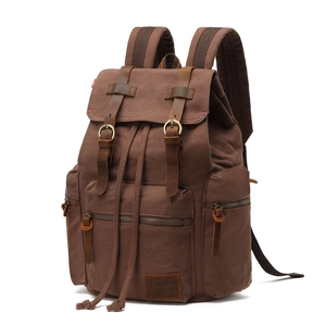 Vintage canvas backpack for men with brown leather straps and multiple zipper pockets