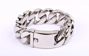 Close-up of thick silver titanium steel Cuban chain with square push-to-press clasp