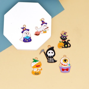 Macro view of Halloween enamel charms including ghost and pumpkin DIY alloy pendants
