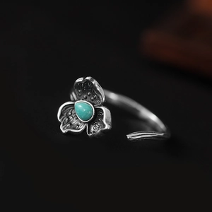 Vintage S925 silver turquoise ring featuring an antique floral design and open adjustable band
