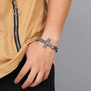 Macro shot of silver hip hop cross link bracelet worn on wrist for men's jewelry styling