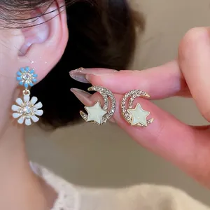 Elegant floral daisy and crescent moon stud earrings with inlaid zircon and oil drip finish