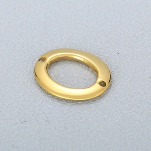 Close-up of polished gold-finished oval stainless steel connector for DIY jewelry making